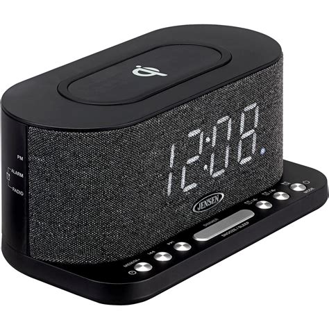 The Jensen QICR-50 digital dual alarm clock radio offers a sleek compact design with two ways to charge your smartphone. . Alarm clock radio with wireless charging